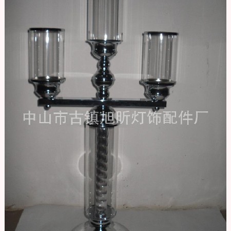 Glass candlestick with stainless steel base